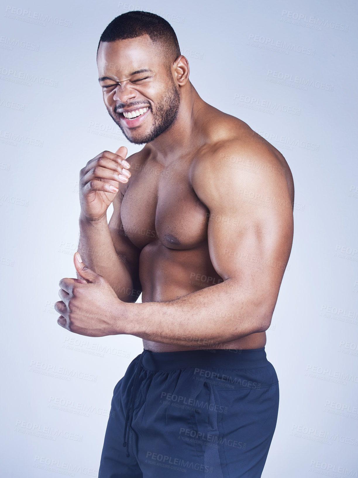 Buy stock photo Black man, portrait and shirtless boxer in studio, strong arms and muscle on blue background. Male person, confident and athlete fighter for power or healthy body, bodybuilder and topless for fitness