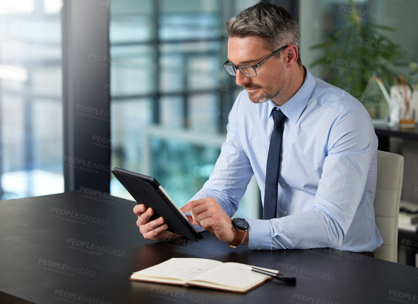 Buy stock photo Businessman, tablet and notebook in office typing for communication, corporate research and company information. Technology, male person and working on online plan for website, social media or sales