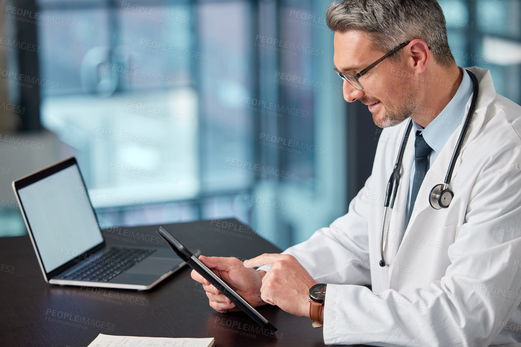 Buy stock photo Mature doctor, tablet and man in office for healthcare, telehealth and blank laptop screen for results. Male person, medicare and app for planning hospital schedule, medical news and website for info