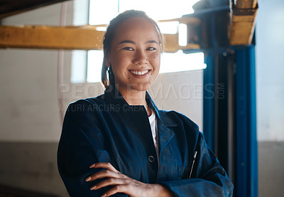 Buy stock photo Happy, Asian woman and arms crossed as car mechanic in workshop with pride for career growth. Female person, confident and smile for startup or small business as engineer for repairs and service