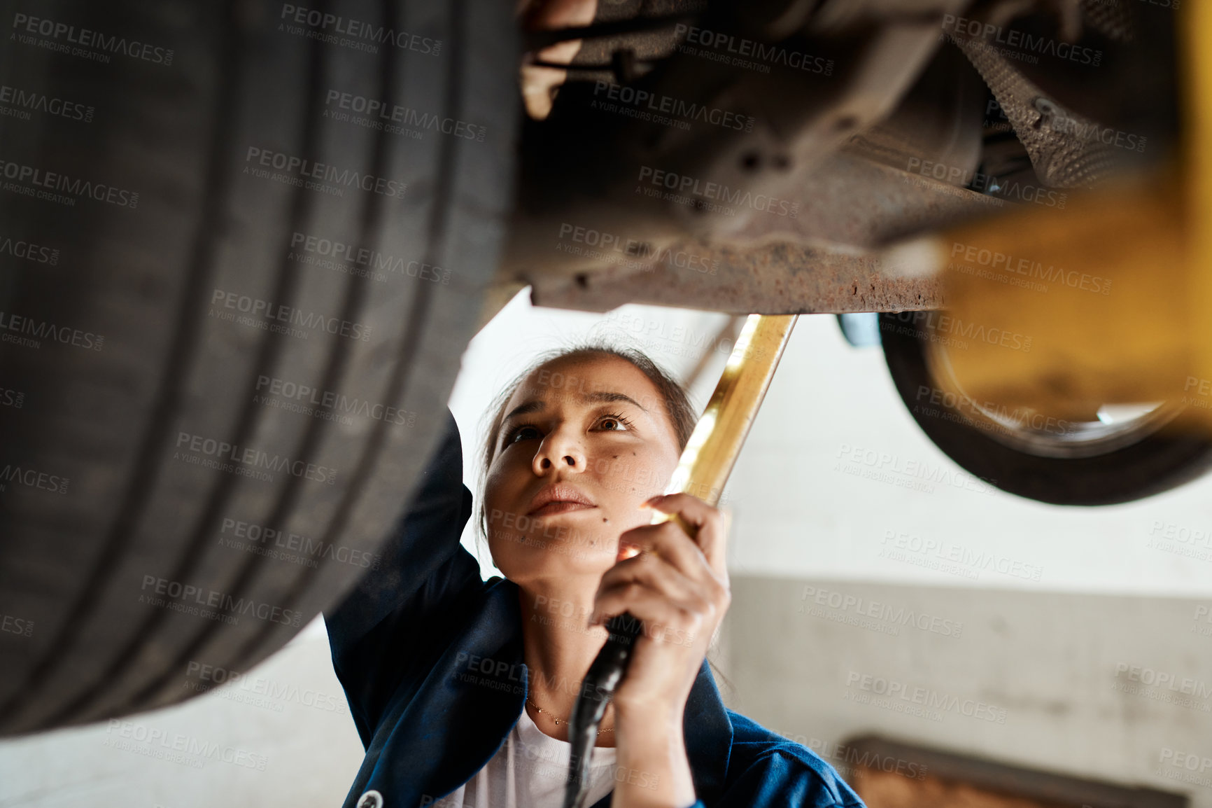 Buy stock photo Car, inspection and light with woman mechanic in workshop for assessment, maintenance or repair. Auto, engineering and service with asian vehicle technician checking engine in garage for quotation