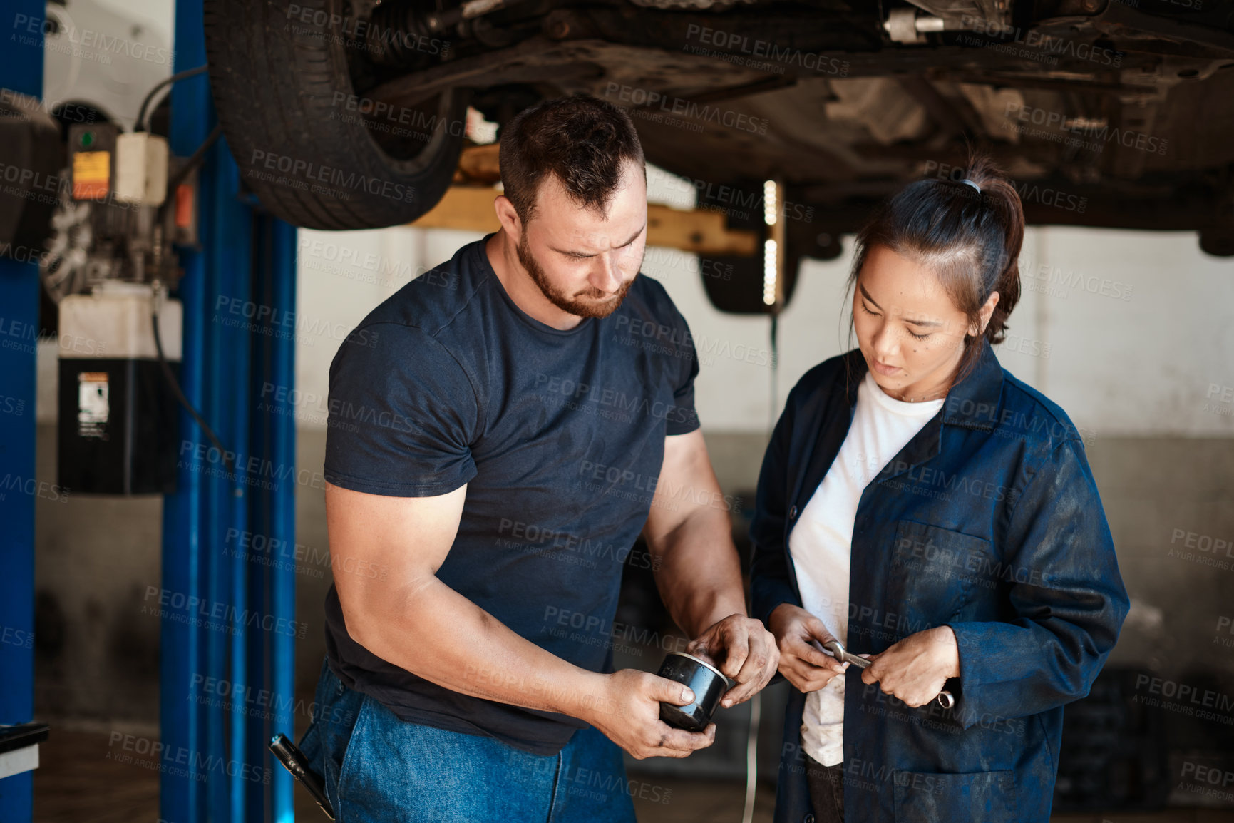 Buy stock photo Mechanic, car and repair of fuel filter with services, solution or problem solving in engineering teamwork. People with part of vehicle or motor at auto shop, garage or workshop for maintenance check