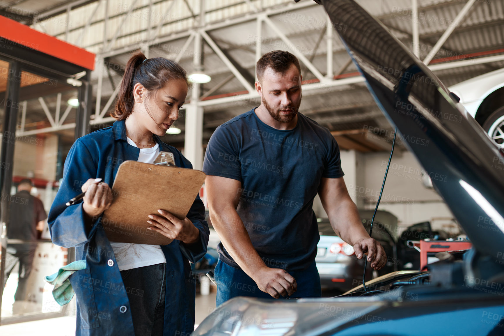 Buy stock photo People, car mechanic and clipboard in garage for inspection with teamwork, collaboration and maintenance. Partner, employee and vehicle repairs or service as engineer with small business and workshop