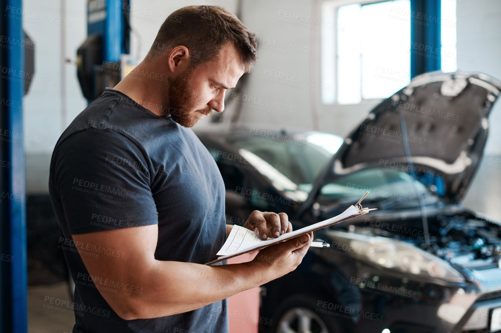 Buy stock photo Man, mechanic and clipboard for car services, maintenance and repair car or safety check in workshop with documents. Engineer or worker in garage or auto business with checklist or inspection papers