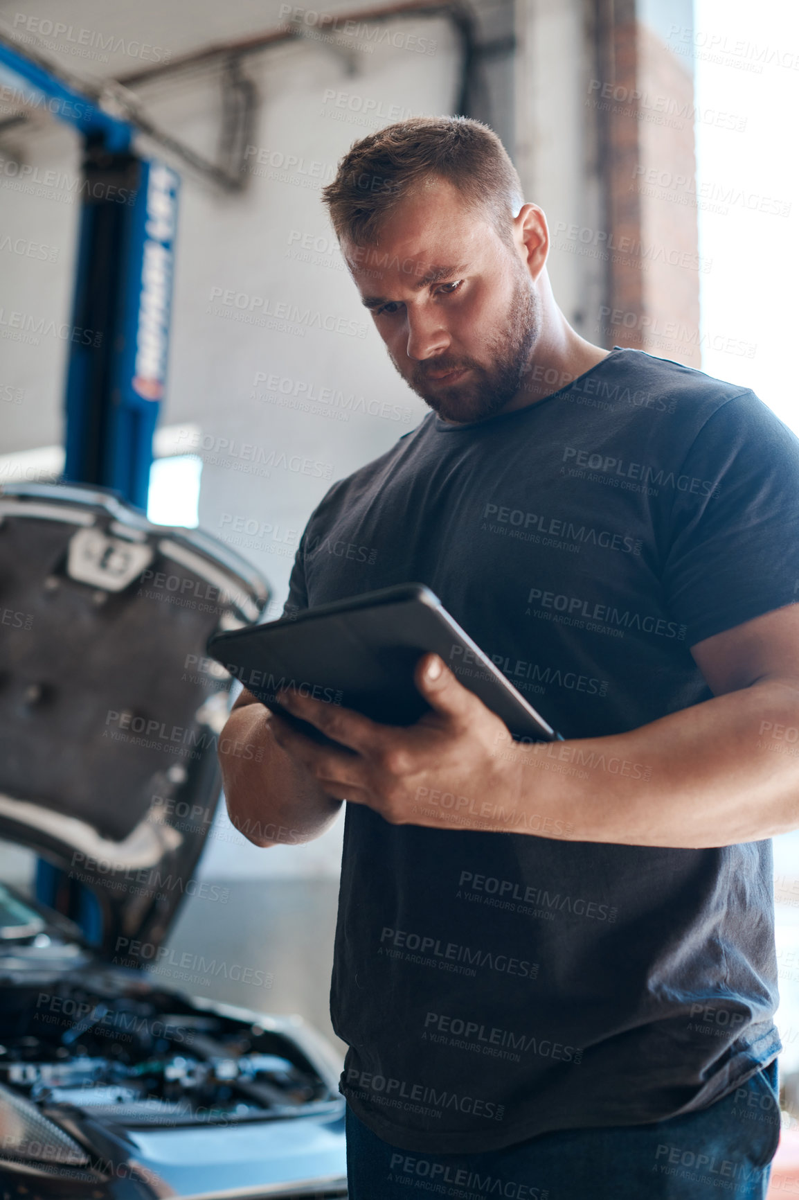 Buy stock photo Man, car mechanic and garage with tablet for inspection or maintenance with online information and instructions. Checklist, employee and vehicle repairs as engineer with small business and workshop