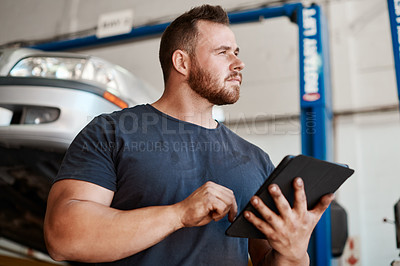 Buy stock photo Mechanic, man and tablet by car in garage for auto repair, service or thinking for diagnostics. Engineer, person and digital touchscreen for vehicle maintenance with app, idea or industry at workshop