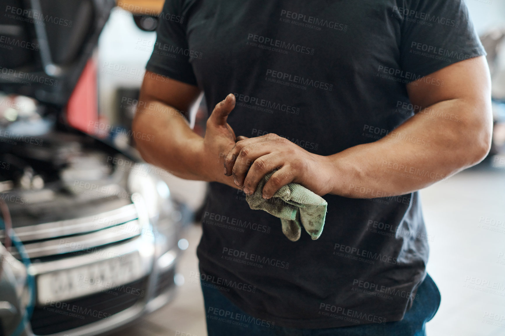 Buy stock photo Cleaning, hands and mechanic in workshop with car service, maintenance or auto insurance at small business. Cloth, engine and man in garage for oil change, motor repair or vehicle quality assurance