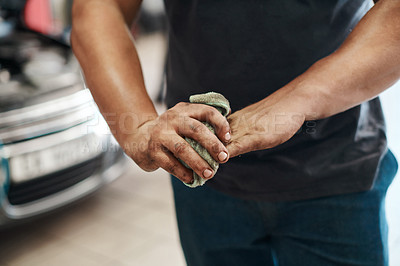 Buy stock photo Cleaning, hands and mechanic in workshop for car in service, maintenance or auto insurance at small business. Cloth, engine and man in garage for oil change, motor repair or vehicle quality assurance