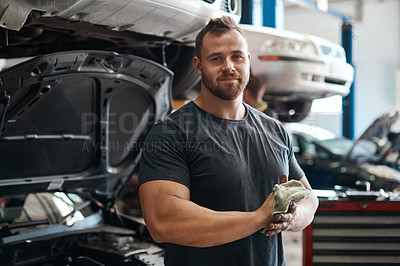 Buy stock photo Cleaning, hands and portrait of mechanic in workshop with car service, maintenance or auto insurance. Cloth, engine and proud man in garage for oil change, motor repair or vehicle quality assurance