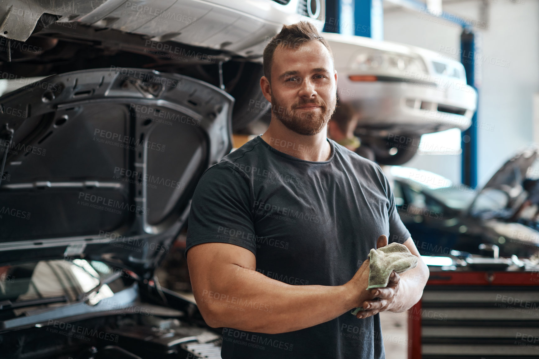 Buy stock photo Cleaning, hands and portrait of mechanic in workshop with car service, maintenance or auto insurance. Cloth, engine and proud man in garage for oil change, motor repair or vehicle quality assurance