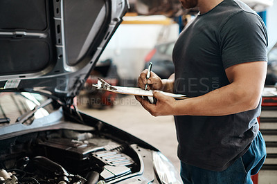 Buy stock photo Clipboard, hands and mechanic in garage with car service, maintenance or auto insurance. Checklist, engine and man in workshop for inspection, motor repair and quality assurance at small business.