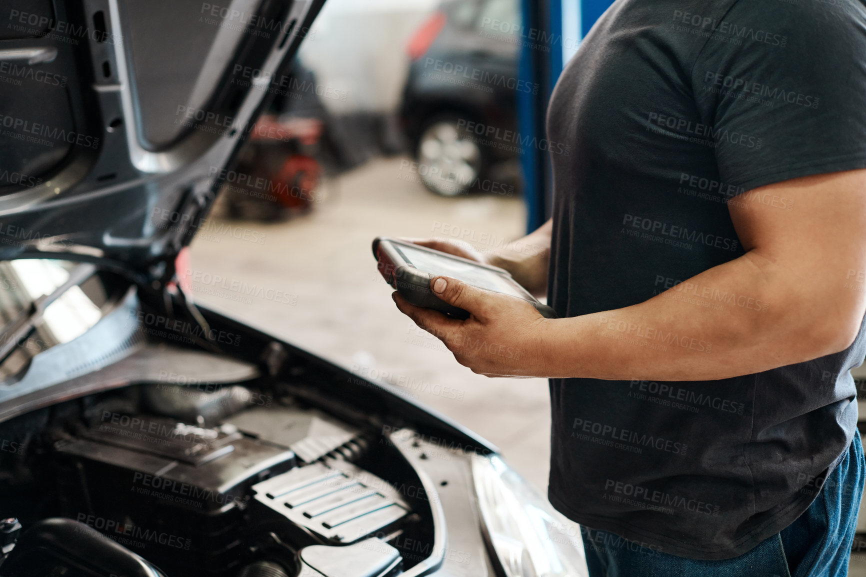 Buy stock photo Electrical, test and mechanic in workshop with car, maintenance or checking motor in service shop. Volt meter, engine and man in garage with machine for inspection, auto repair and quality assurance