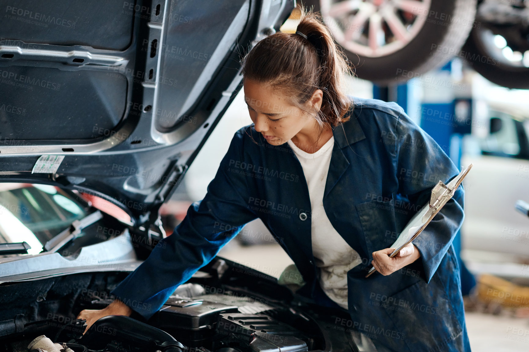 Buy stock photo Workshop, woman or car mechanic with clipboard for working, maintenance and engine inspection. Repair shop, service and female expert with checklist, auto experience and fixing vehicle in garage