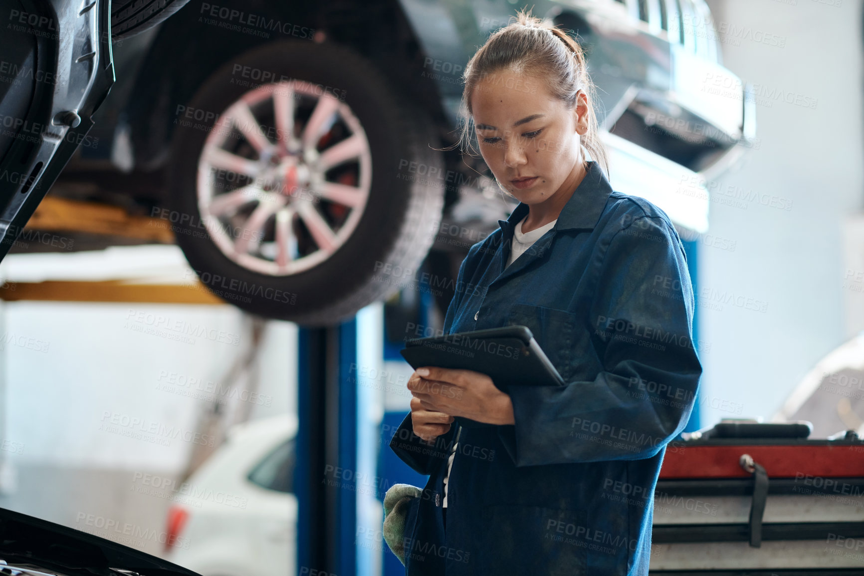 Buy stock photo Tablet, checklist and woman in workshop with car service, maintenance or online motor insurance. Tech, engine and female mechanic in garage on digital app for inspection, repair and quality assurance