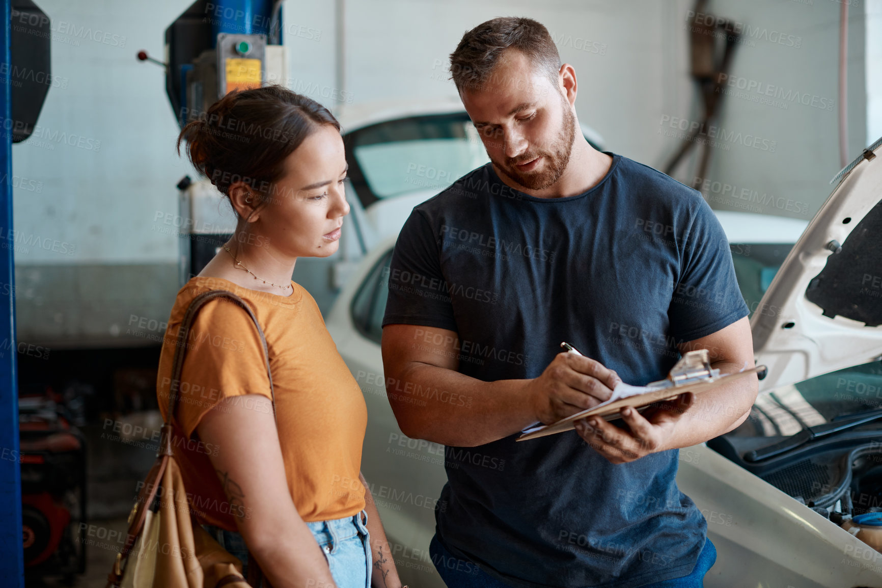 Buy stock photo Woman, mechanic and sign document in auto repair shop, invoice and service for car maintenance. Female person, clipboard and customer for vehicle transaction, contract and garage workshop for quote