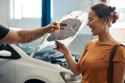 Buy stock photo Shot of a woman receiving her car keys