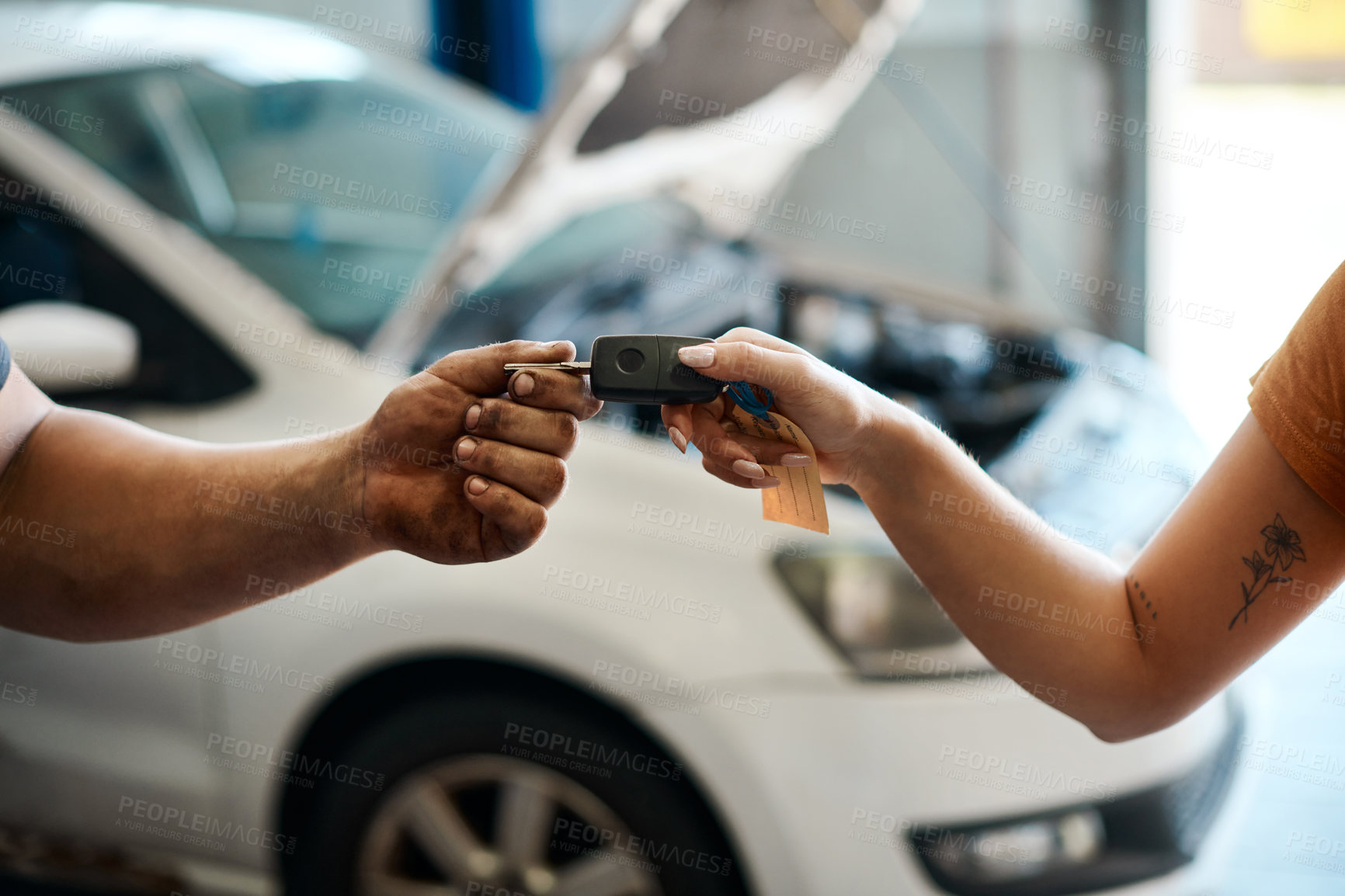 Buy stock photo Shot of a woman receiving her car keys