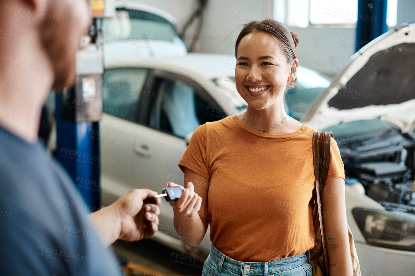 Buy stock photo Shot of a woman receiving her car keys