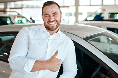 Buy stock photo Shot of a car salesman in his dealership