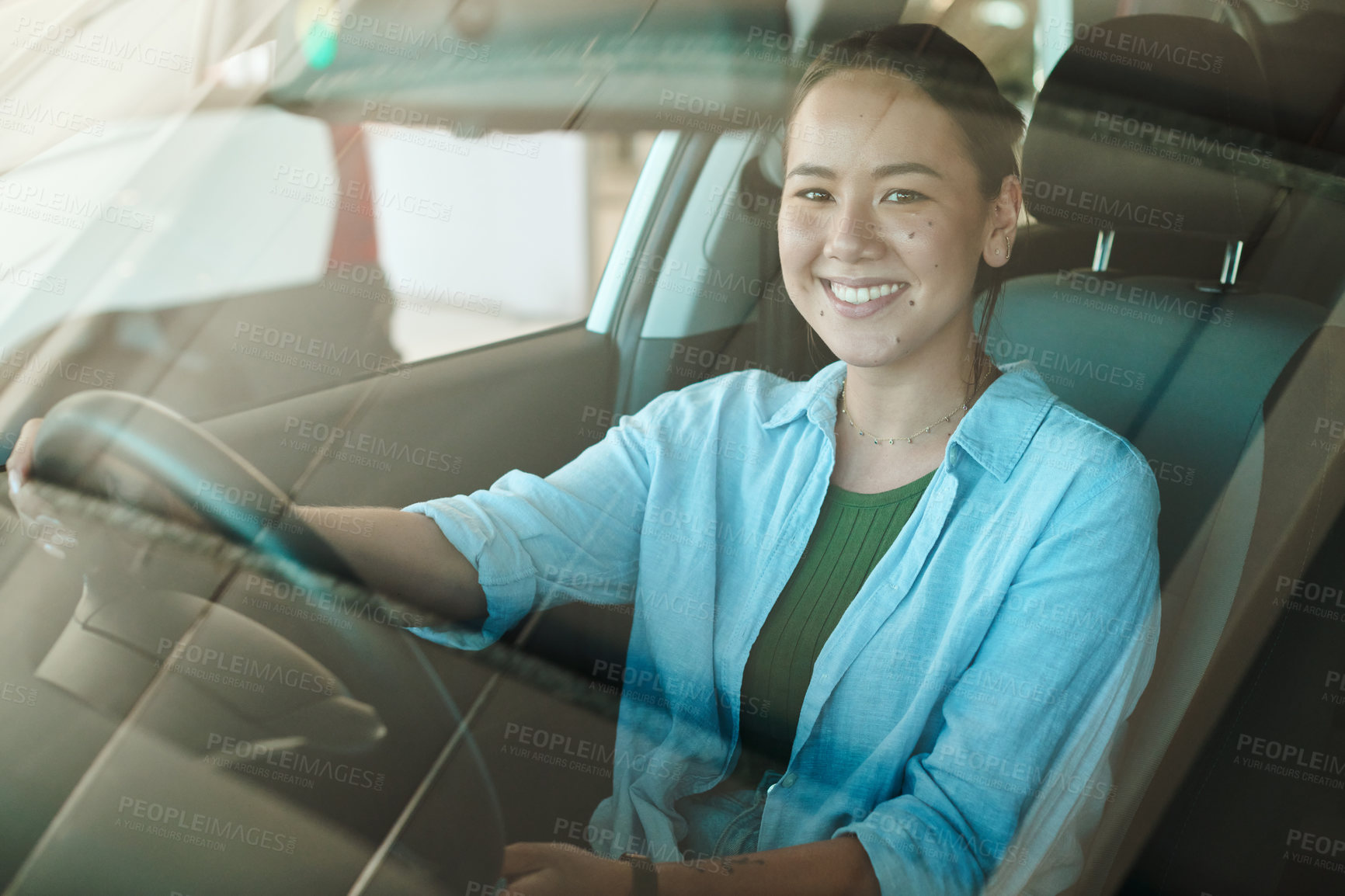 Buy stock photo Woman, windscreen portrait and smile for driving car with new purchase, vehicle test and shopping in showroom. Girl, driver and motor for chauffeur job with travel, journey and professional service