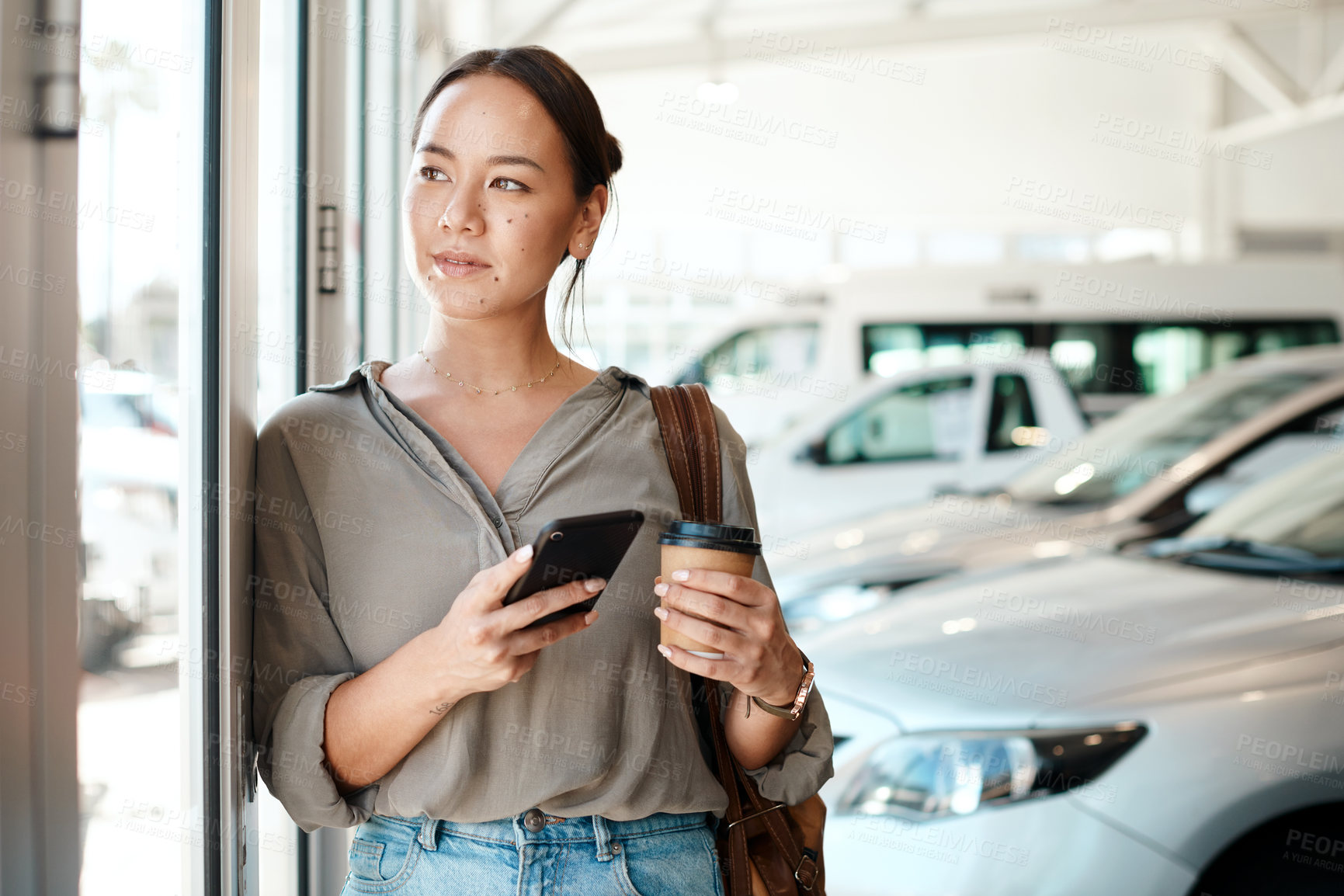 Buy stock photo Asian woman, thinking and phone at car dealership or coffee, customer and website for research. Female person, communication and app for vehicle review or online survey, showroom and tea for planning