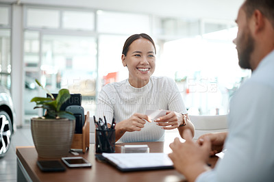 Buy stock photo Shot of two businesspeople having a conversation in their office