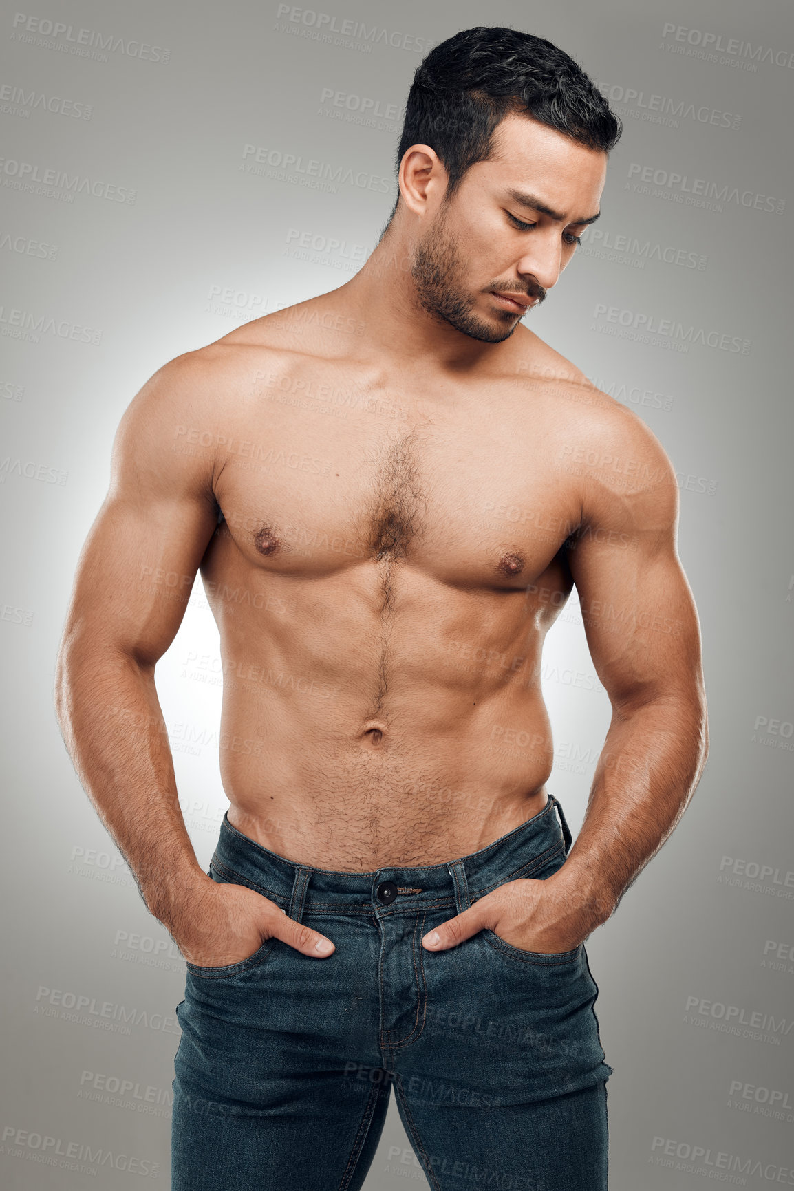 Buy stock photo Man, body and thinking in studio with muscles or abs, shirtless and grey background with model or bodybuilder. Jeans, strong chest and Asian male person on backdrop, confidence with six pack