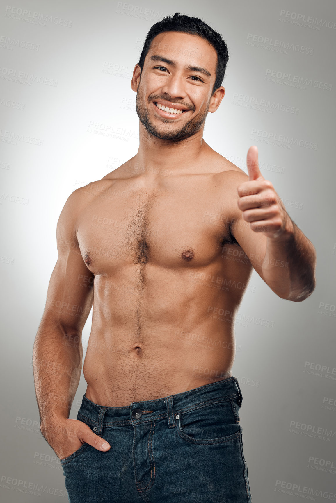 Buy stock photo Thumbs up, fitness and Asian man in portrait with smile, body positivity and topless in studio. Happy person, approval and proud of progress from exercise, wellness and goal on gray background