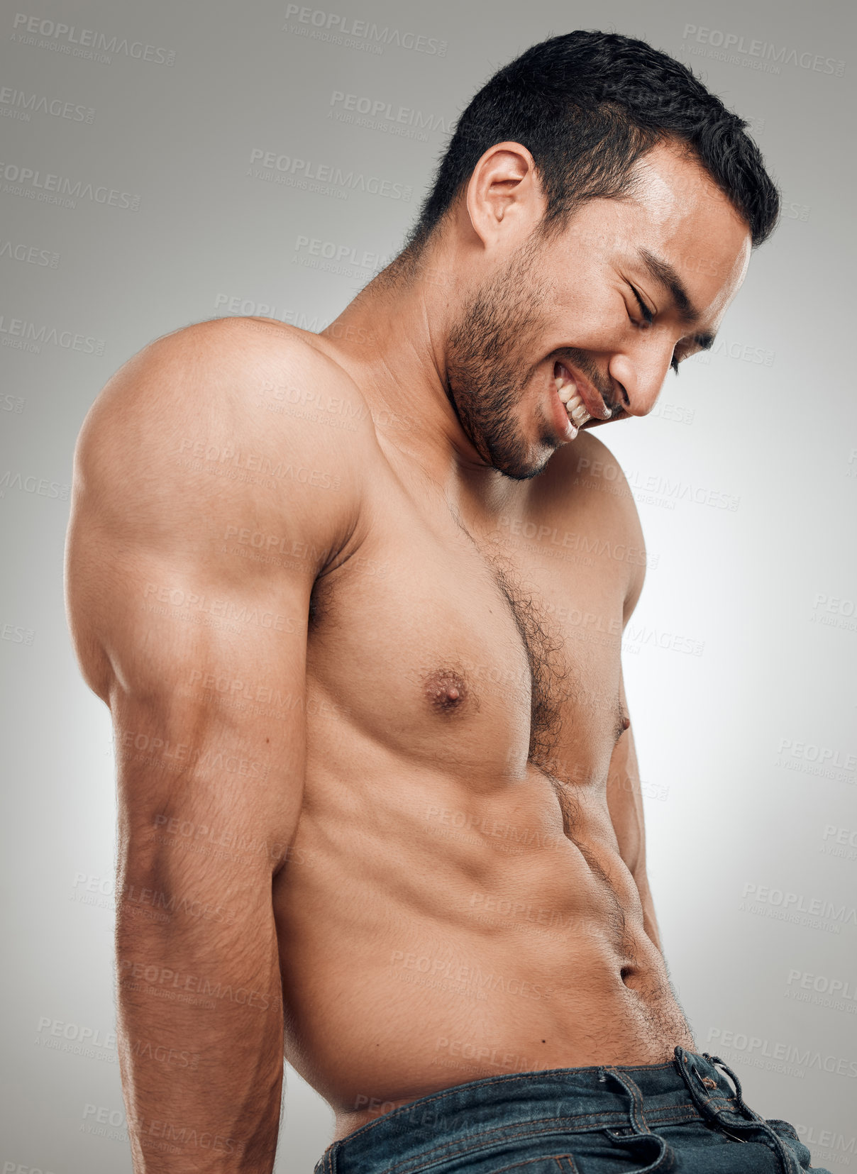 Buy stock photo Man, thinking and confident in studio with abs or muscles, shirtless and grey background with model bodybuilder. Jeans, strong chest and Asian male person on backdrop, happy and six pack results