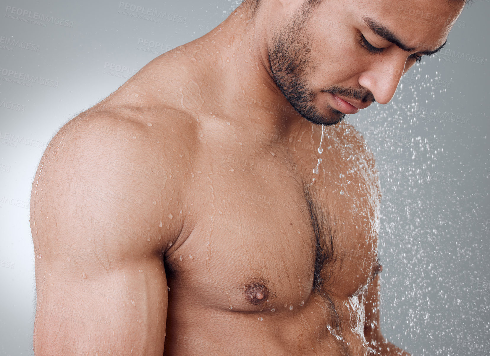 Buy stock photo Man, water and washing in studio for skincare, wellness and cleaning or grooming on gray background. Male person, cosmetics and liquid for treatment in morning routine, health and hygiene or beauty