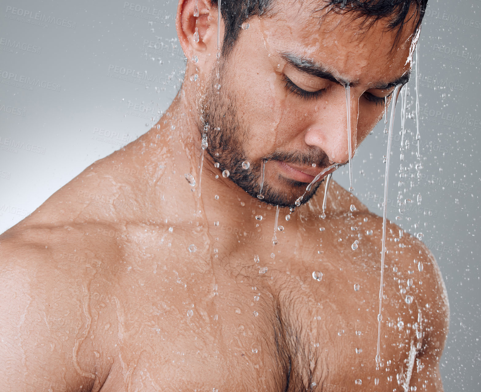 Buy stock photo Thinking, shower and man in water with splash, topless and wellness on gray background. Skincare, relaxation and male person in bathroom with luxury, cleanliness and grooming or refreshment at home