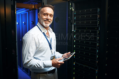 Buy stock photo Portrait of a mature man using a digital tablet while working in a server room