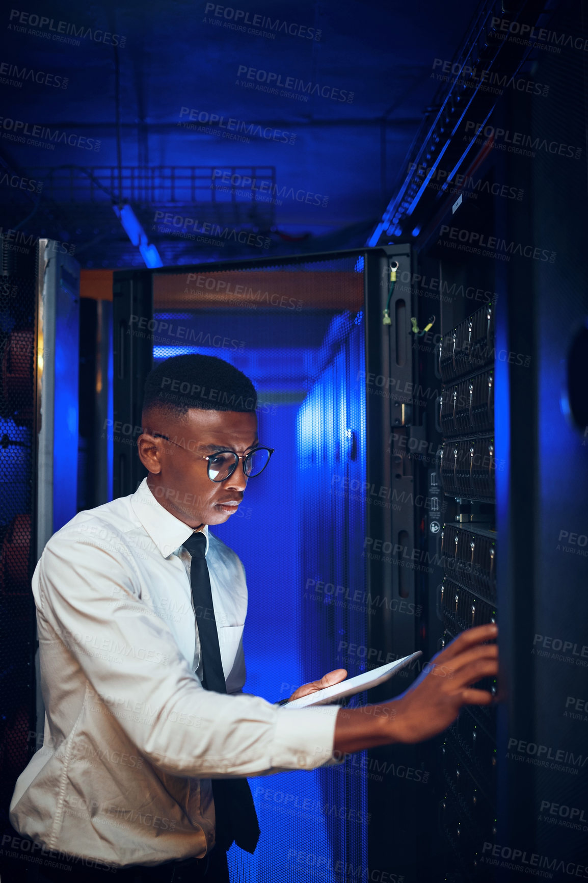 Buy stock photo Technician, man or tablet with server room inspection for rack maintenance, system backup or solution. IT engineer, black person or tech in dark data center for diagnostics, hardware check or upgrade