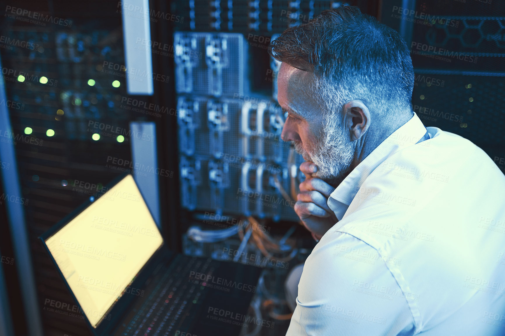 Buy stock photo Engineer, decision and man with laptop screen in server room, reading or planning for system upgrade. Serious, mature person and network management with computer, thinking and information technology