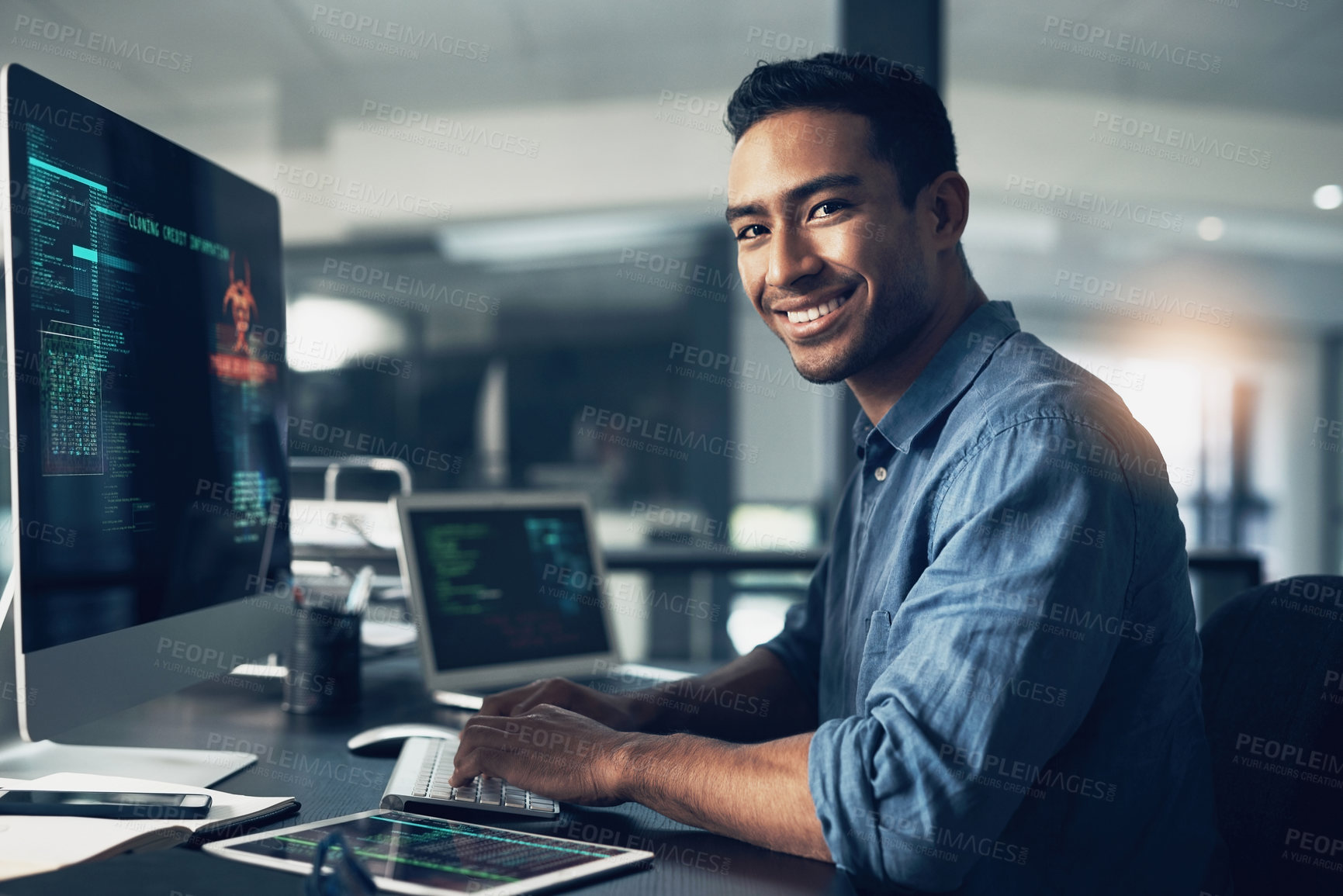 Buy stock photo Portrait, man and smile of programmer on computer in office workplace at night. IT, face and male coder or person programming, coding and writing for software development or information technology.