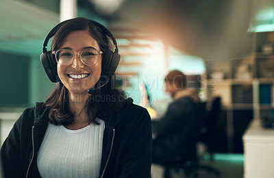 Buy stock photo Portrait of a young woman using a headset in a modern office