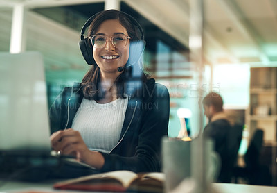 Buy stock photo Portrait of a young woman using a headset in a modern office