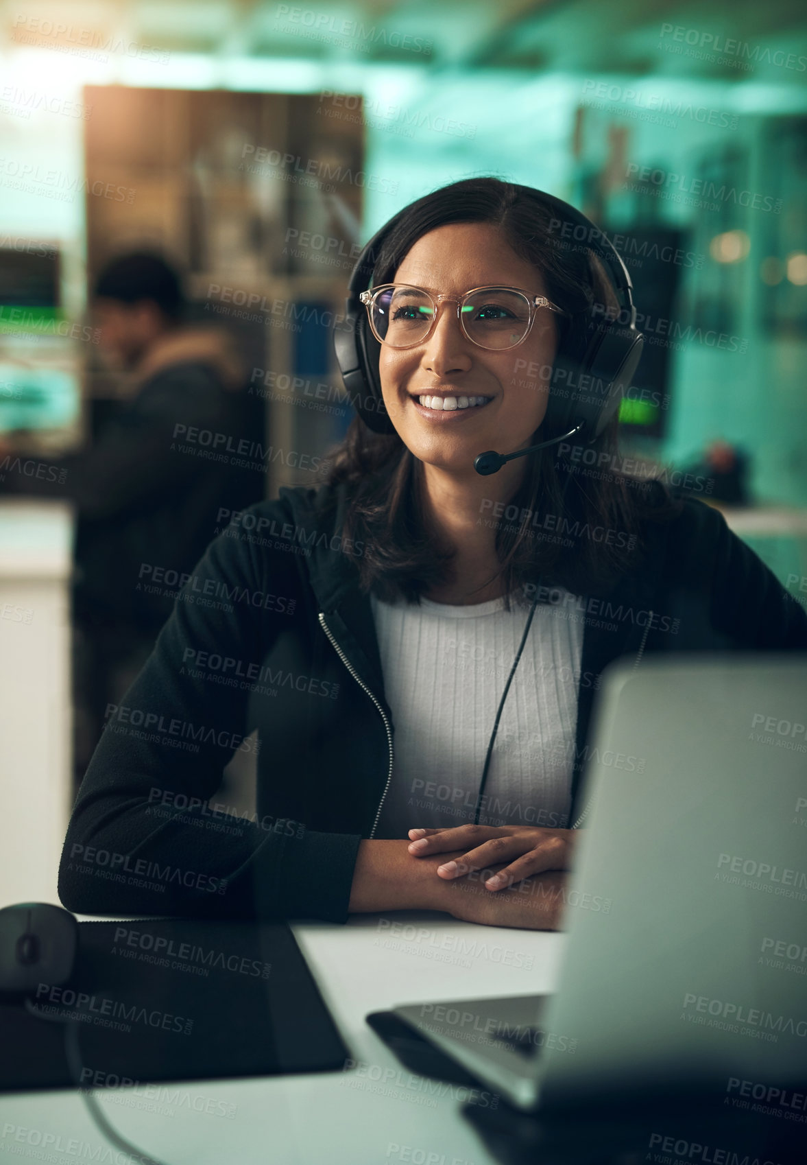 Buy stock photo Shot of a young woman using a headset in a modern office