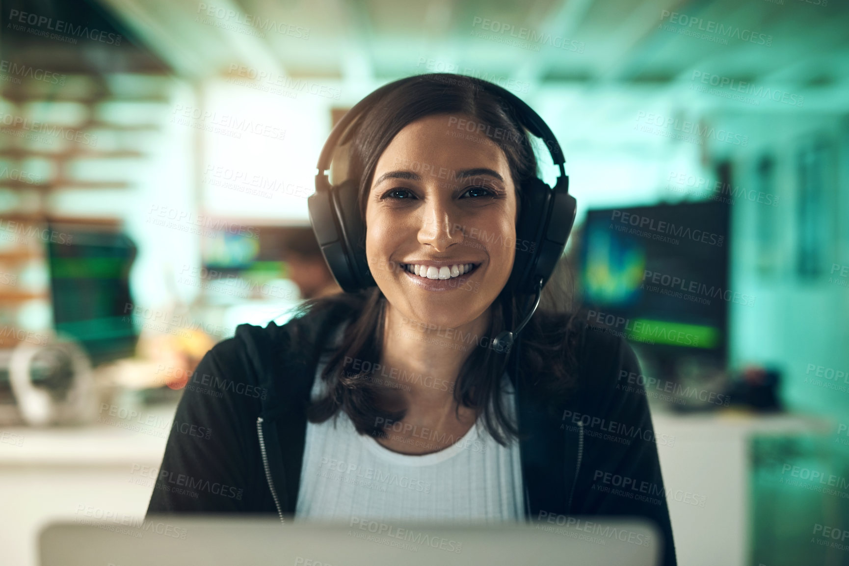 Buy stock photo Portrait of a young woman using a headset in a modern office