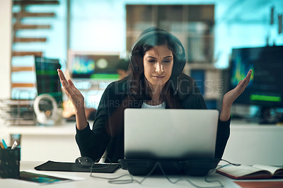 Buy stock photo Portrait of a frustrated young woman using a headset in a modern office