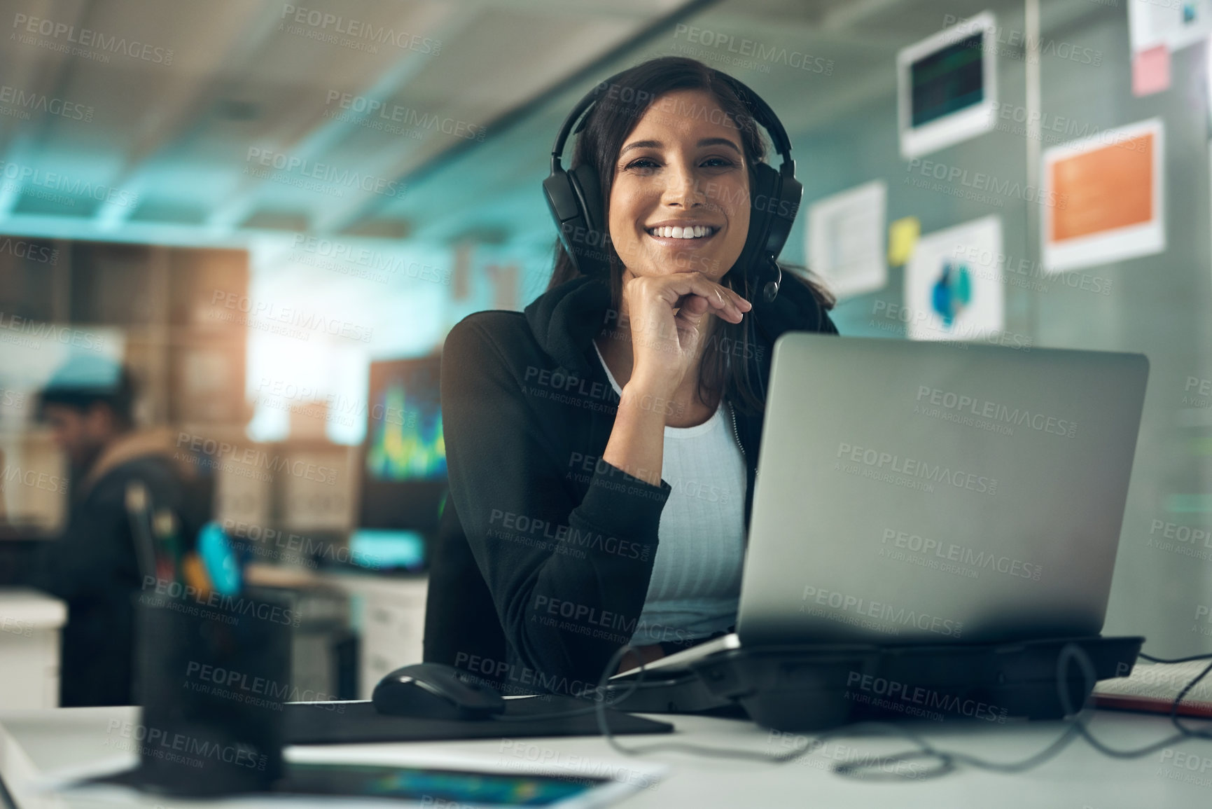 Buy stock photo Portrait of a young woman using a headset in a modern office