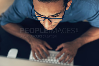 Buy stock photo Cropped shot of a young using a computer in a modern office