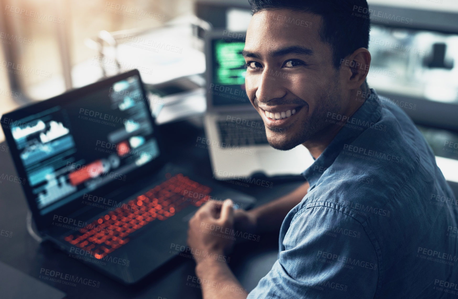 Buy stock photo Portrait, man and smile of programmer on computer in office workplace at night. IT, face and male coder or person programming, coding and writing for software development or information technology.