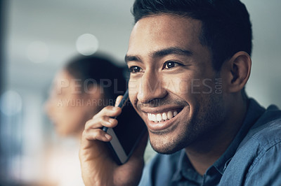 Buy stock photo Closeup shot of a young man using a cellphone in a modern offie