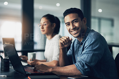 Buy stock photo Man, portrait and happy programmer on laptop in office for deadline at night. IT, face and male coder programming, coding or writing for software development or information technology with coworker.