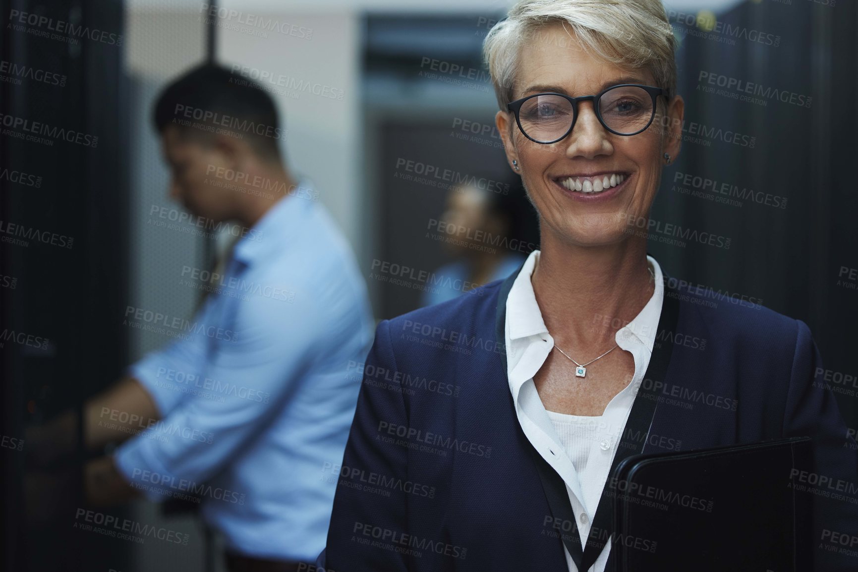 Buy stock photo Data center, server room and portrait of woman with team for programming, coding and information technology. Cybersecurity, IT and technician manager for inspection, maintenance and software backup