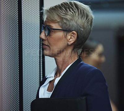 Buy stock photo Shot of a mature woman working in a server room