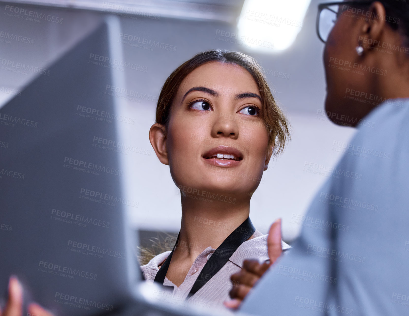 Buy stock photo Women, laptop and communication in server room for IT, cybersecurity and collaboration in workplace. Female programmers, computer and discussion with technician for brainstorming, plan and issues