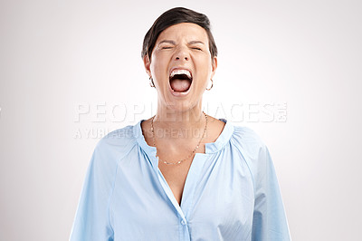 Buy stock photo Cropped shot of an attractive young woman shouting in studio against a grey background