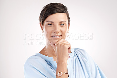 Buy stock photo Cropped portrait of an attractive young woman posing in studio against a grey background
